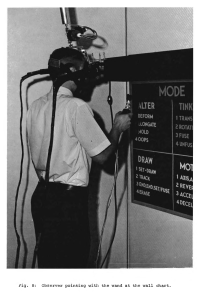 A man using Sutherland's sword of damocles VR headset and Vickers' magic wand interface