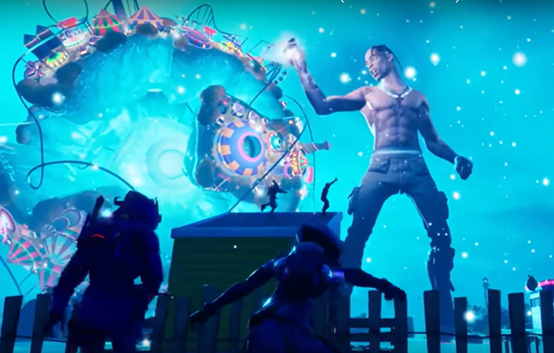 Still from Travis Scott Fortnite concert. In the foreground, there are two video game avatars dancing to the music, with a further two avatars dancing on a building in the middle ground. In the background to the right there is a very large cartoon version of Travis Scott with his arms in the air rapping. To his right there is a trippy, translucent sphere with a rollercoaster and carnival tents on its surface